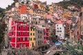 Italy, Riomaggiore Ã¢â¬â 13 April 2019: view of Riomaggiore roofs and the sea, Cinque Terre, Liguria Royalty Free Stock Photo